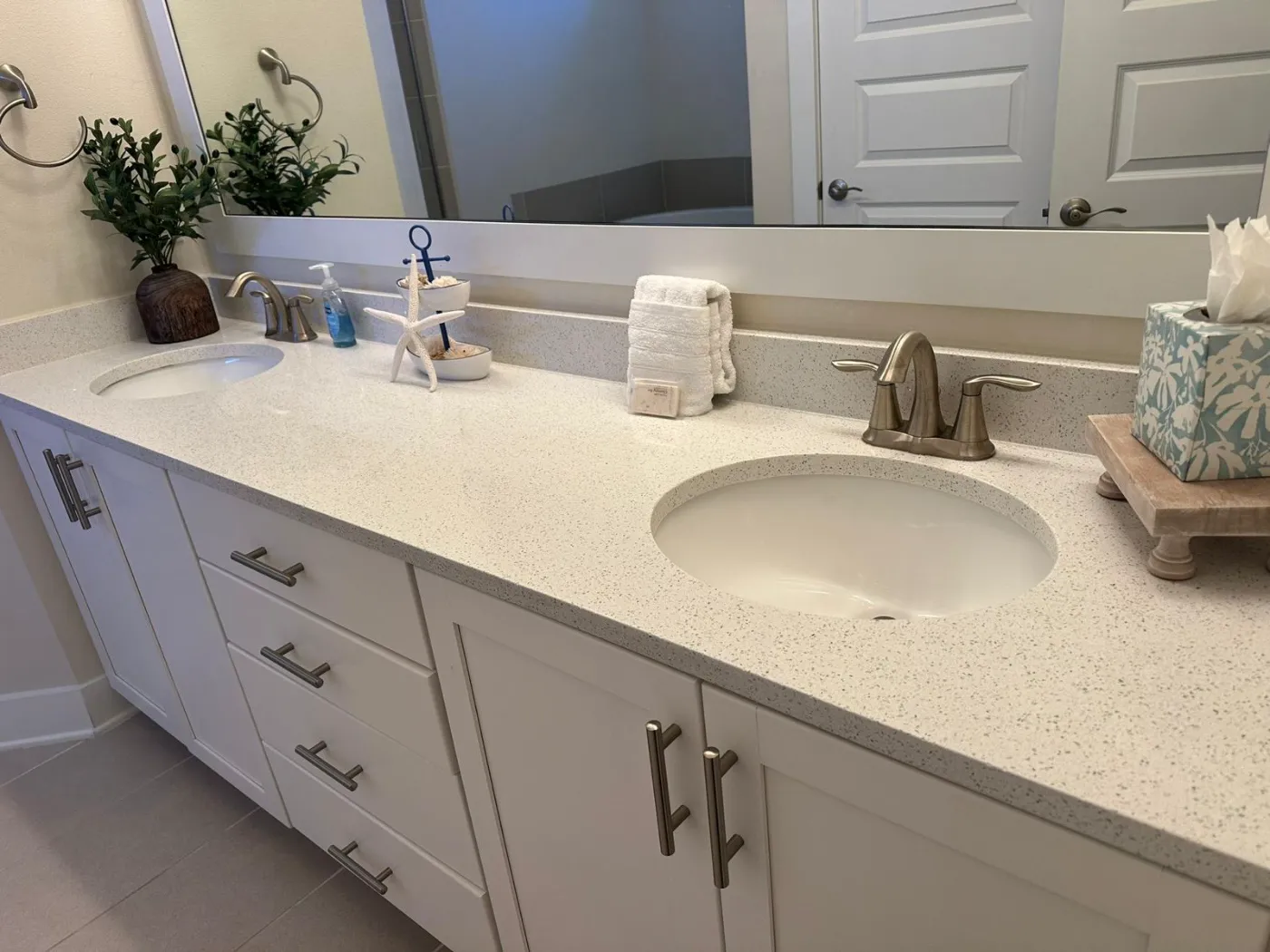 Double-sink bathroom vanity, counters and mirror cleaned by Alyne Oliver Cleaning in Panama City, FL