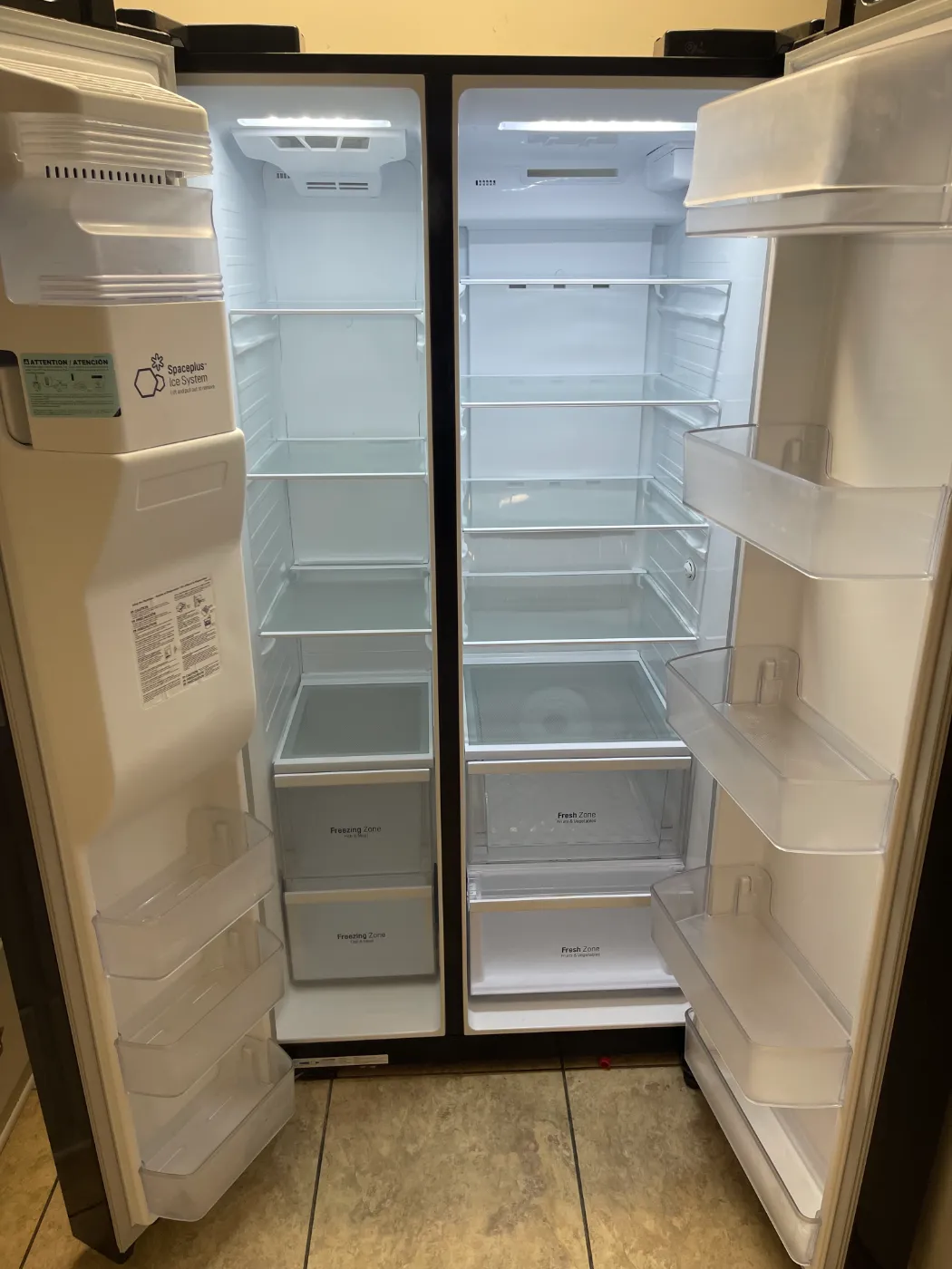Refrigerator wiped clean inside, shelves, drawers and door bins, by Alyne Oliver Cleaning in Panama City, FL