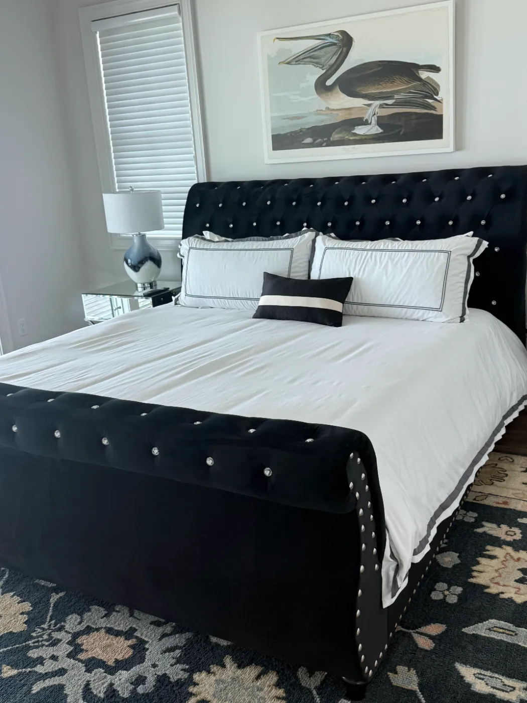 Vacation rental bedroom with crisp white bedding, guest-ready after cleaning by Alyne Oliver Cleaning in Panama City Beach, FL